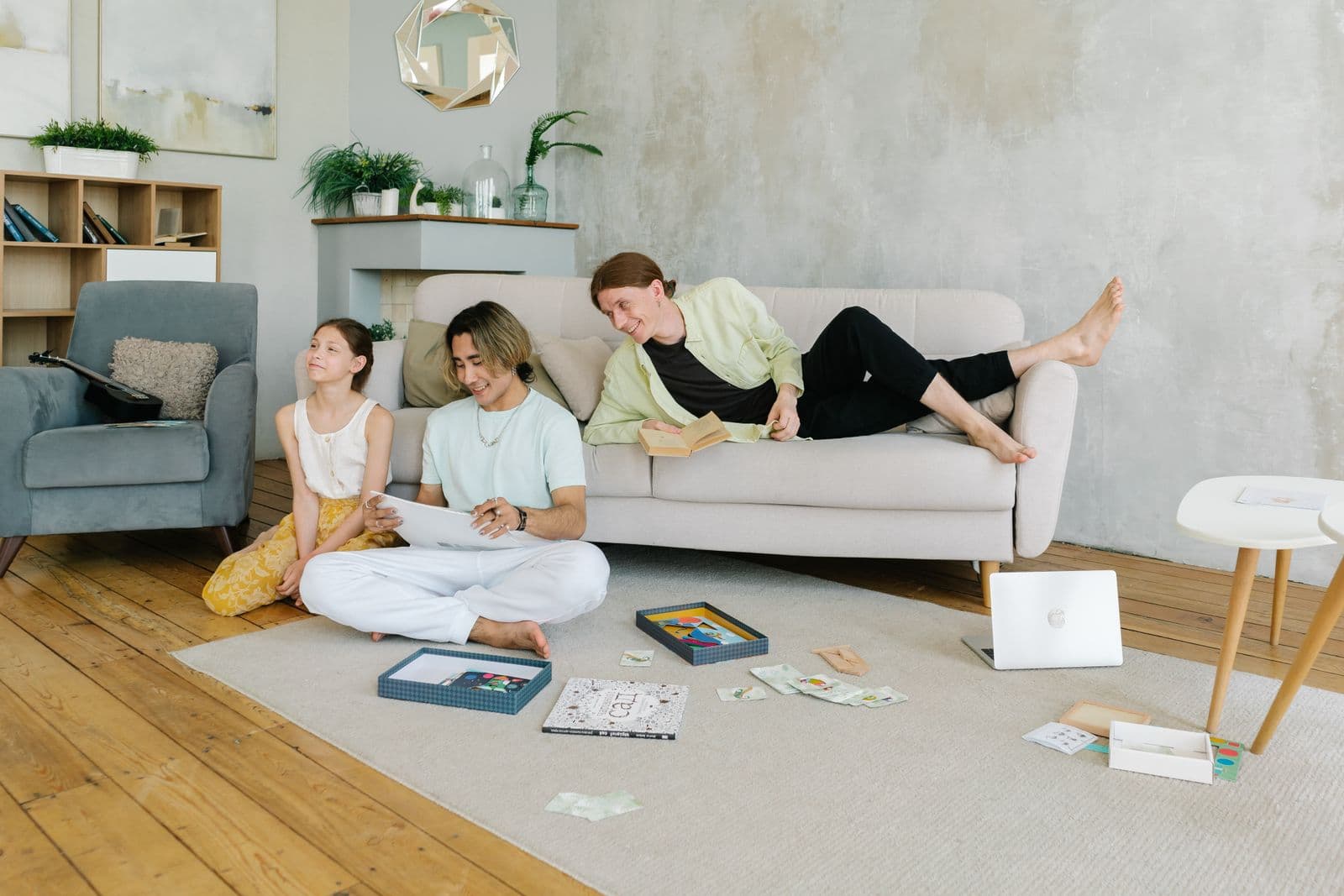 A relaxed family at ease in a bright living room at home.